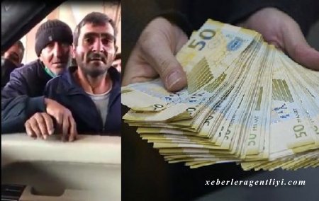 Bakıda naməlum şəxs insanlara pul paylayır - VİDEO